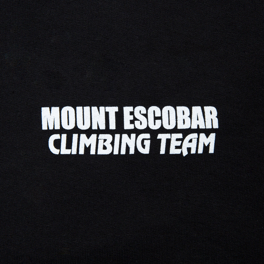 Close-up view of front graphic print of Made in Paradise World Drug Trade Collection "MOUNT ESCOBAR" black hoodie