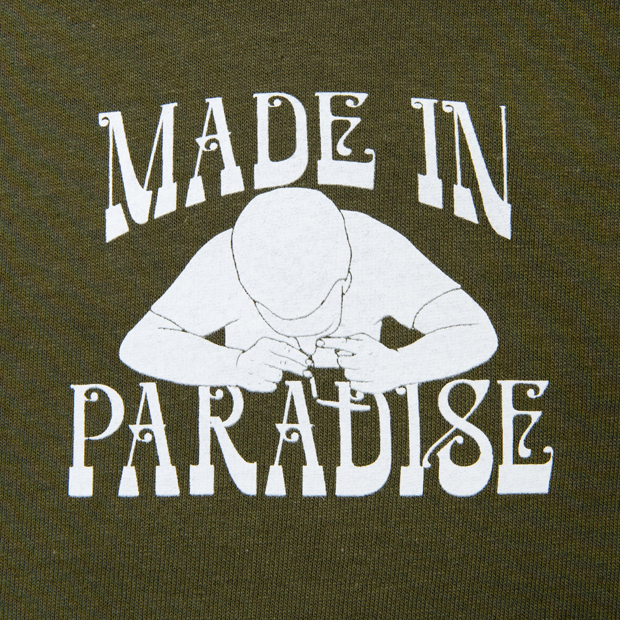 Close-up view of front graphic print of Made in Paradise World Drug Trade "COCAINE PRICES" green olive long sleeve t-shirt