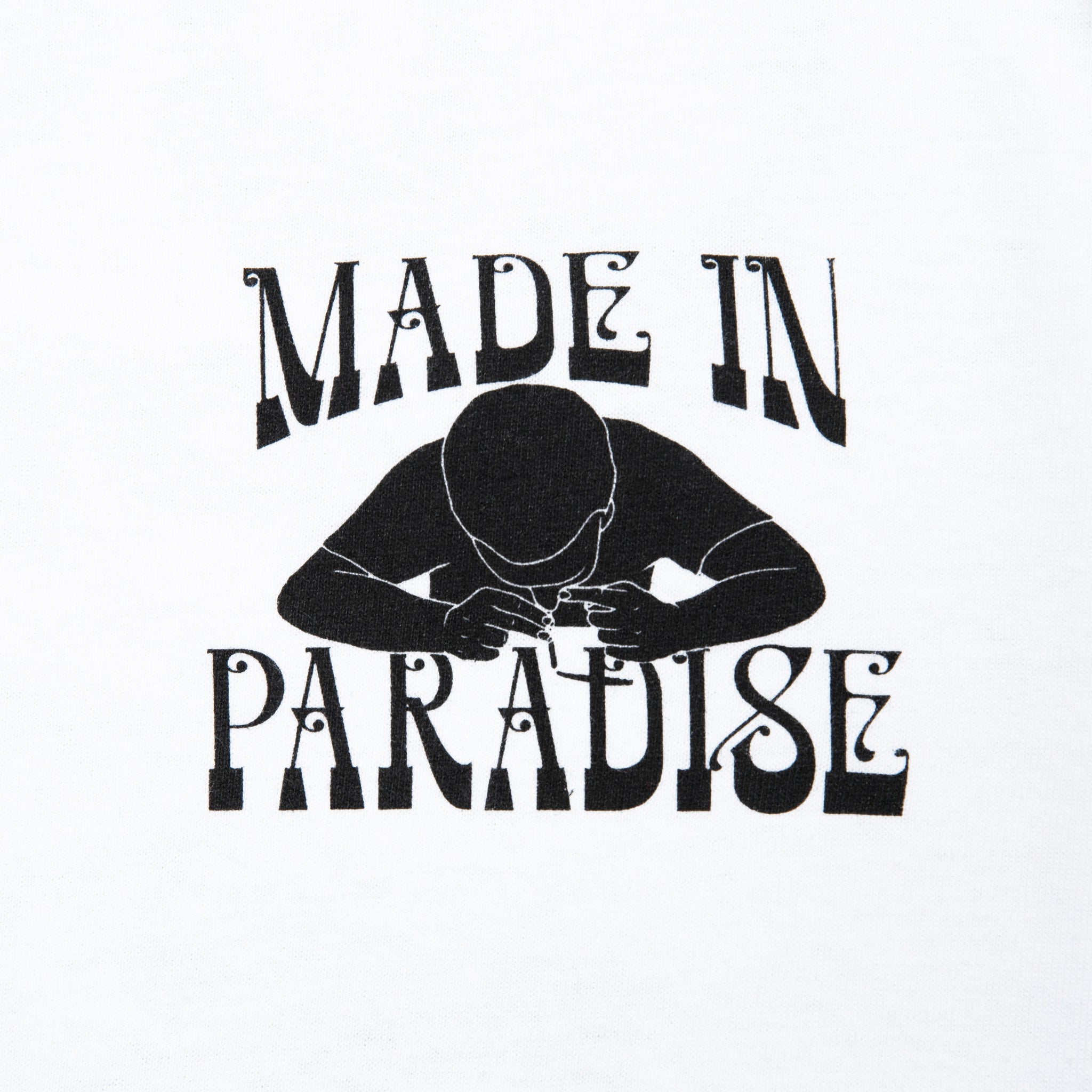 Close-up view of front graphic print of Made in Paradise World Drug Trade "COCAINE PRICES" white long sleeve t-shirt